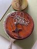 Sterling red garnet cross pendant