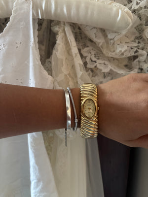 Geneva gold watch cuff