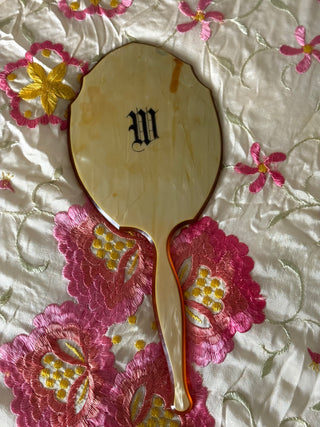Handheld “M” mirror