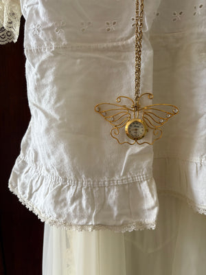 Butterfly clock necklace